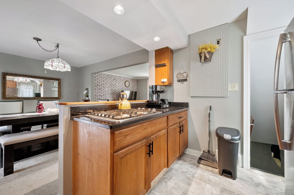 Stove top, coffee/tea maker, pots, pans and silverware storage