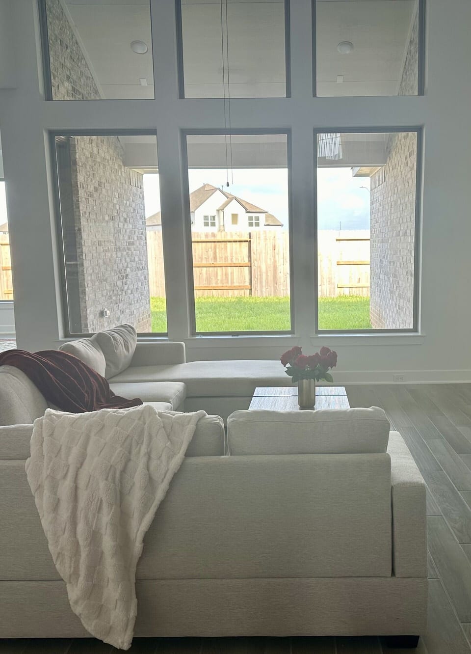 Family room with high ceilings, 70” tv and fireplace