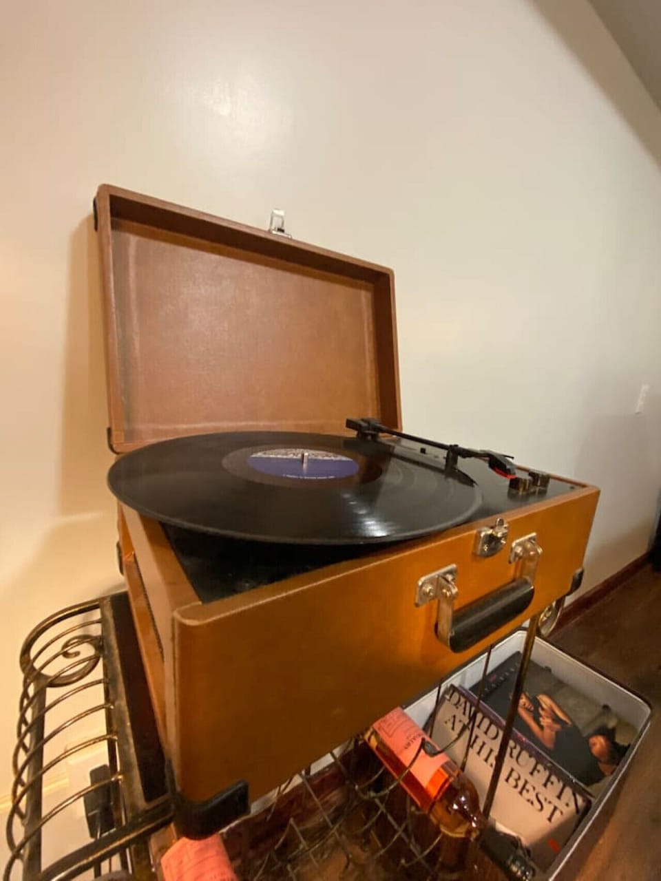 Enjoy endless entertainment in the basement game room! Featuring a flat-screen TV, foosball table, bar with ice maker, seating, and a vintage record player for added charm.