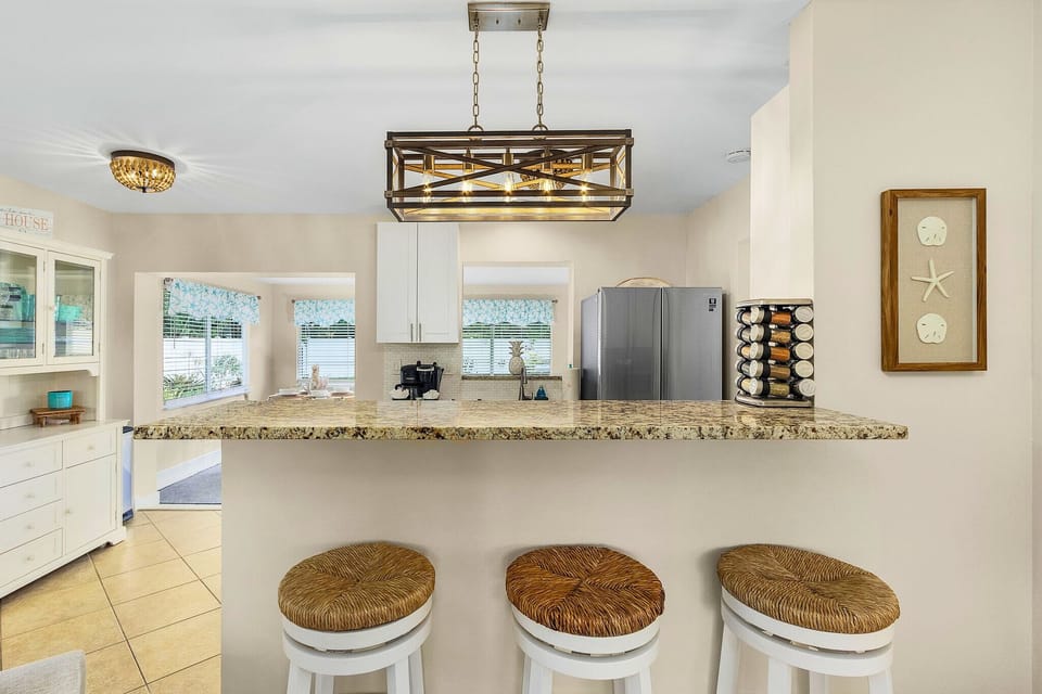 Gather, chat, and create memories. This kitchen counter is the perfect spot for casual conversations and enjoyable moments.