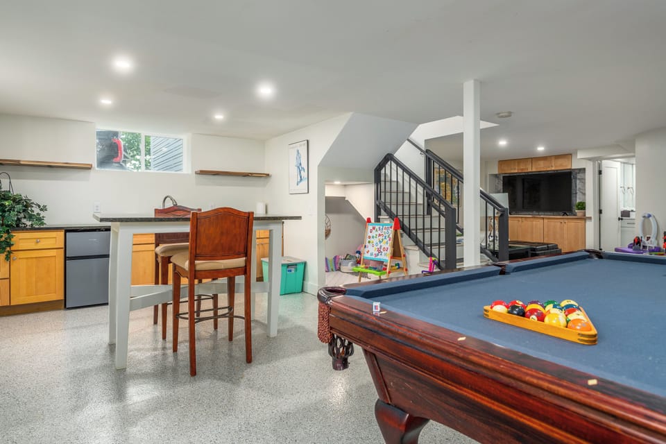 Finished Basement with wet bar and pool table.