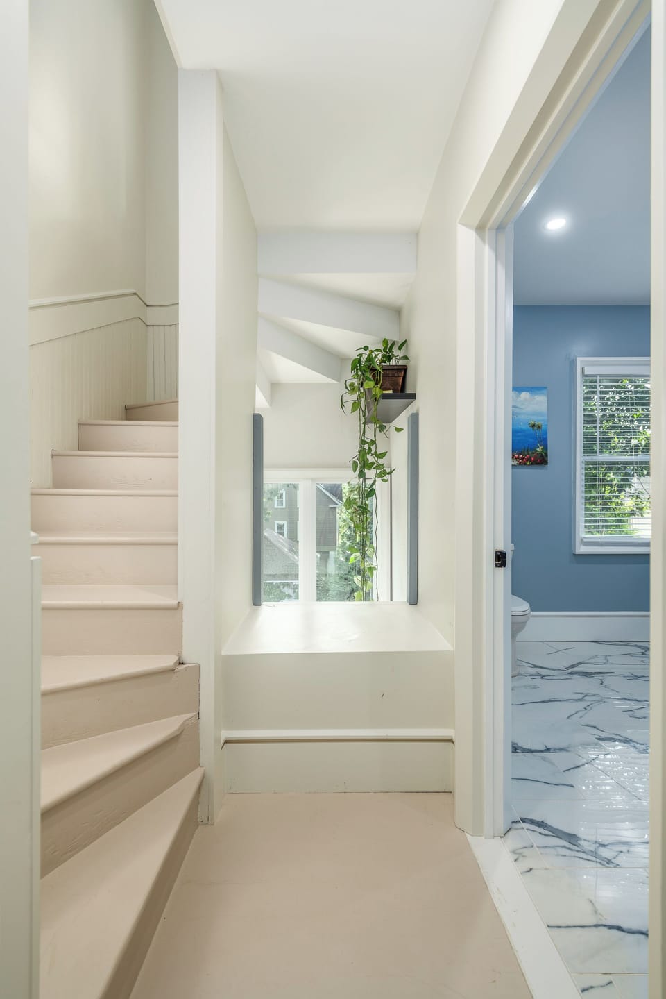 Hallway to third floor and guest bathroom