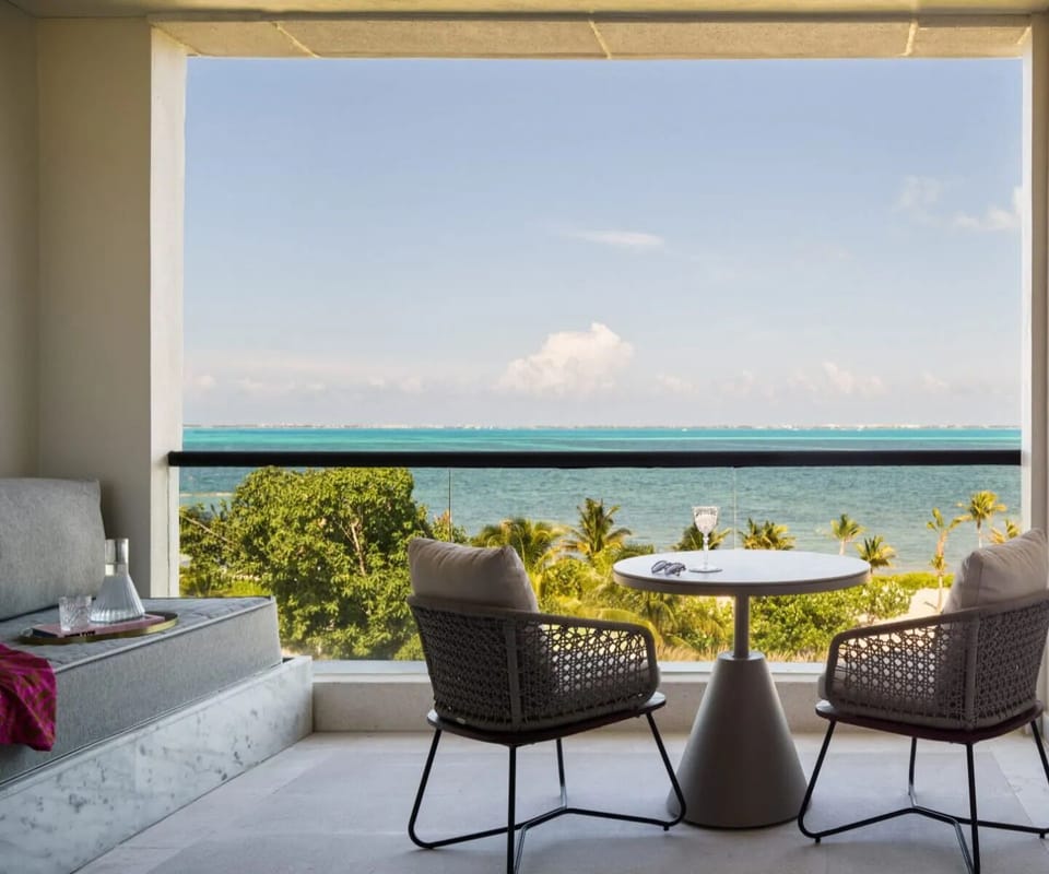 Sip morning coffee on the balcony overlooking turquoise waters.