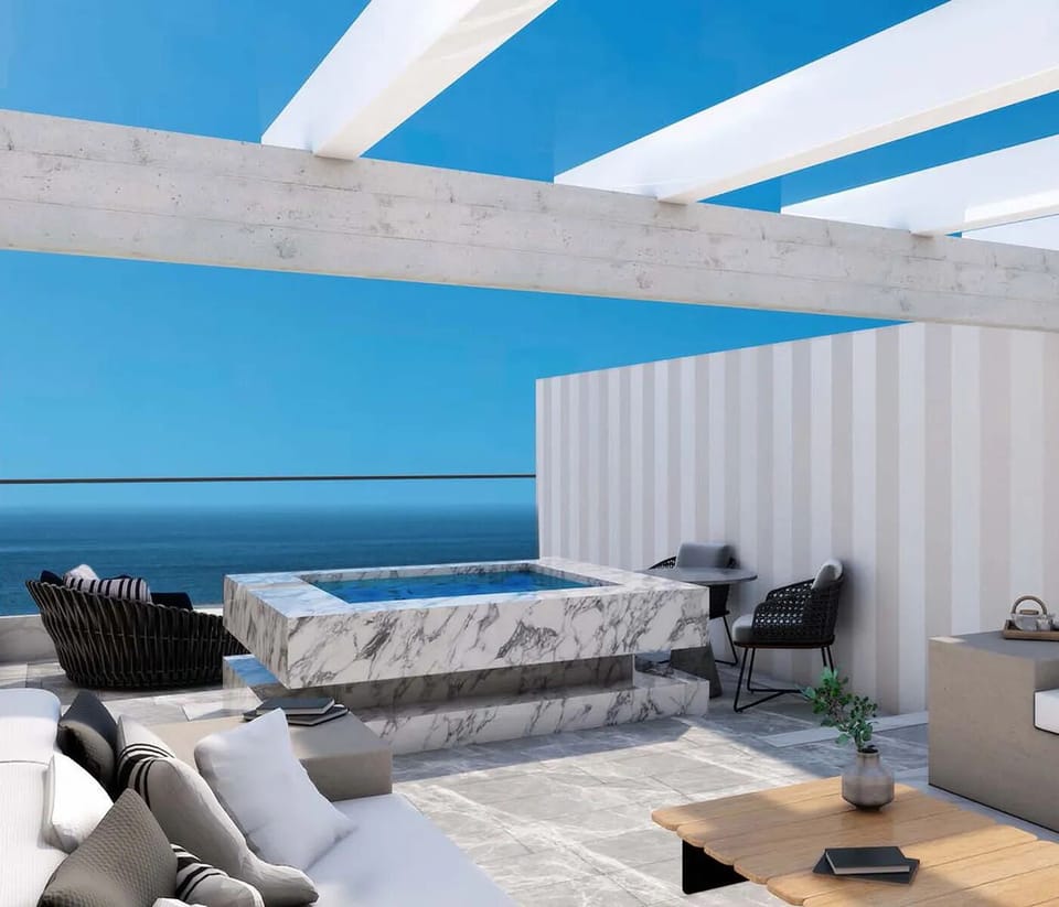 Sink into a rooftop hot tub facing the open sea.