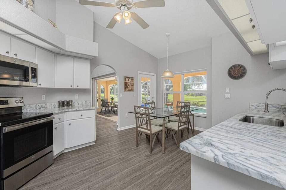 Dining Room Table in Kitchen with Pool Views