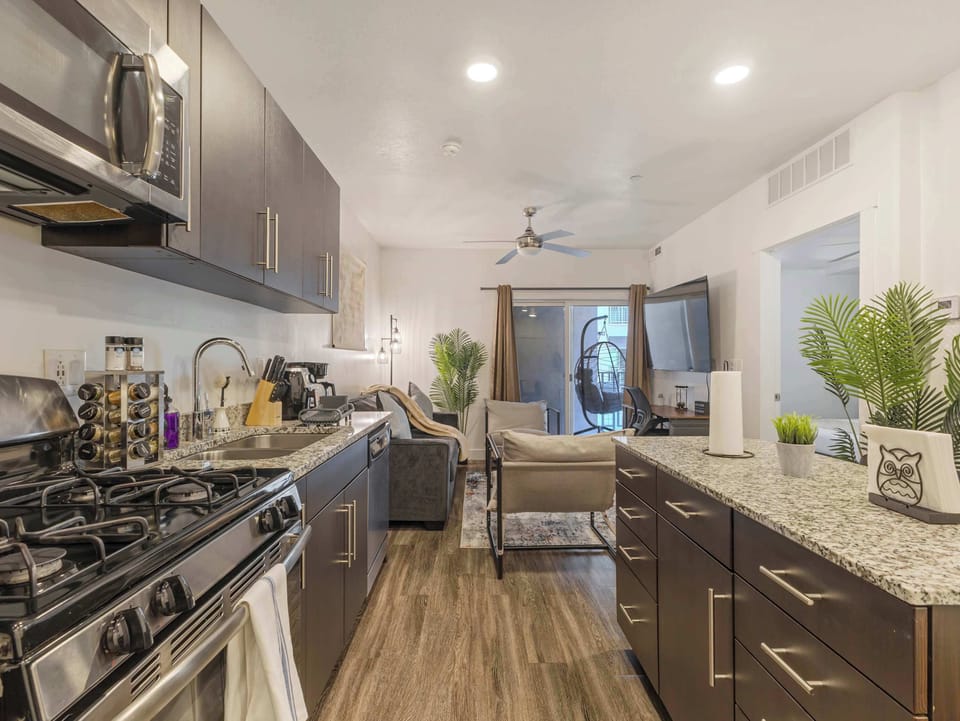 Spacious kitchen w/ granite counters, gas range & plenty of prep space