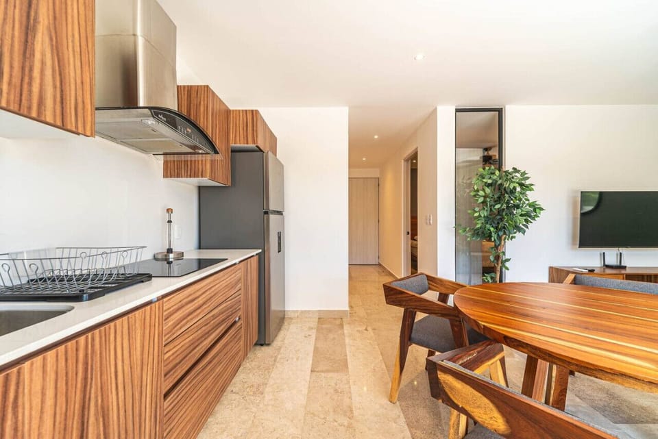 Open-concept dining area for four, great for socializing while cooking and dining