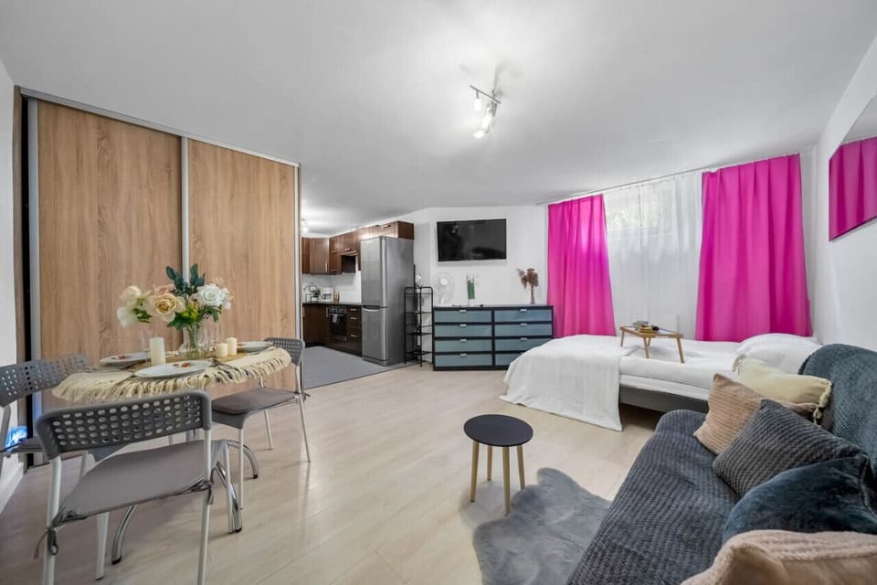 Comfortable Living Room with Sofa Bed and Smart TV | Book Now with RENTUJEMY