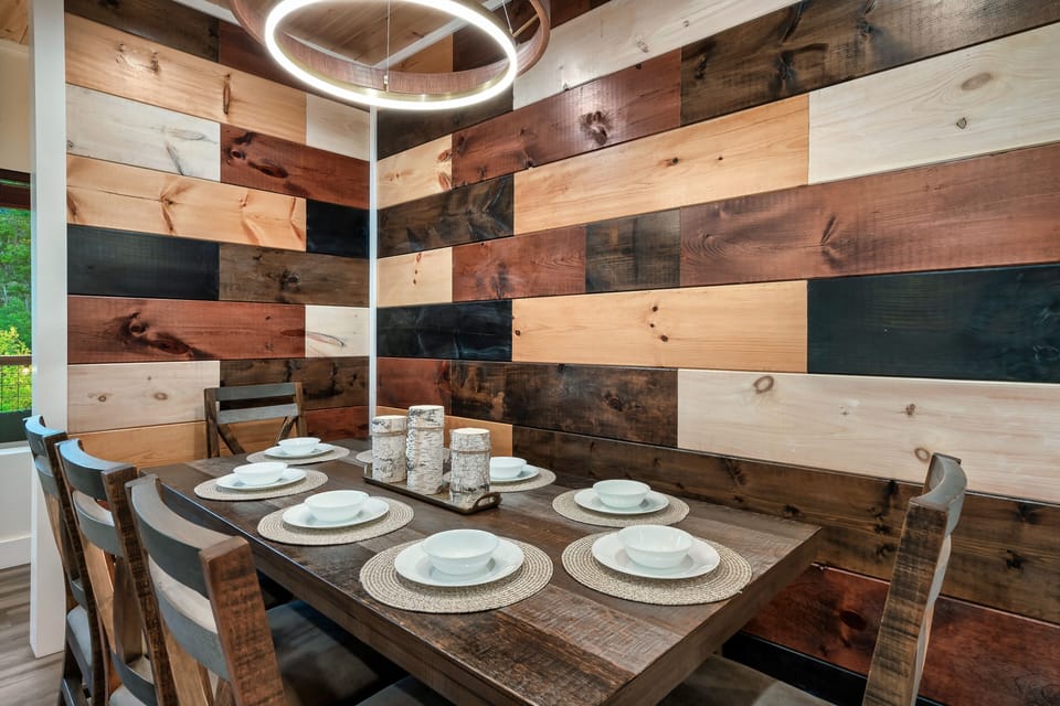 The large dining table seats 8 and is the perfect place to share a meal.