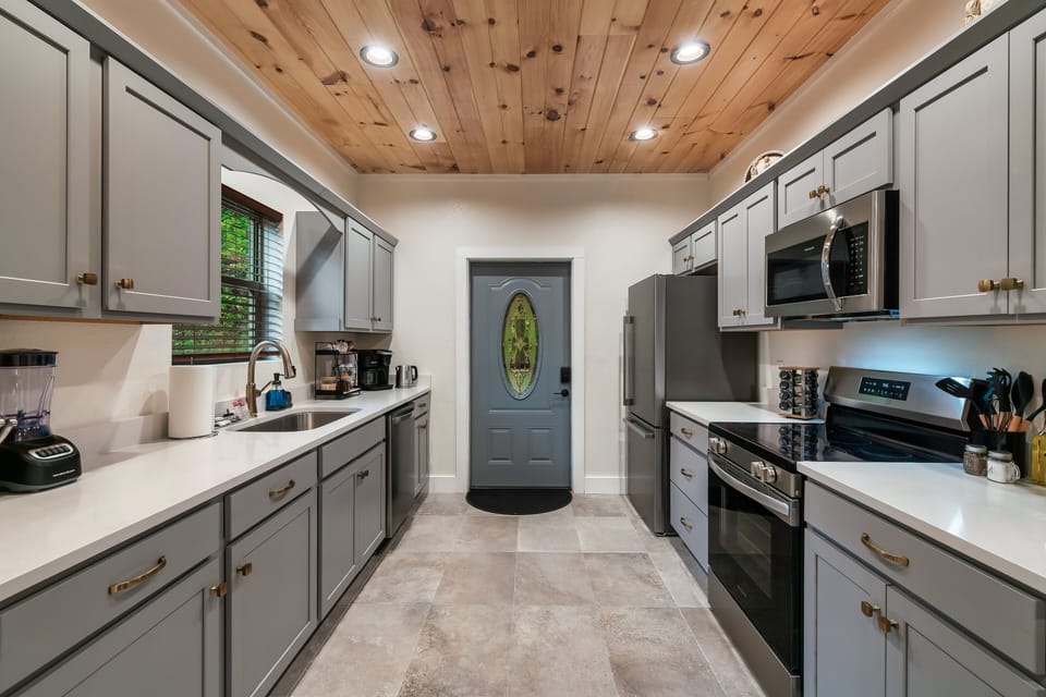 The cabin's front door opens to a spacious kitchen with plenty of counter space.