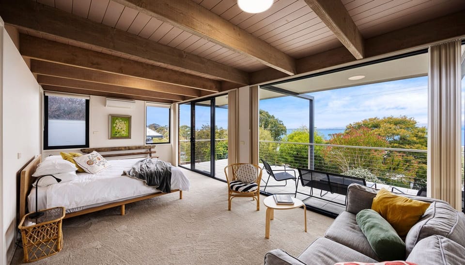 Spacious bedroom with bay views