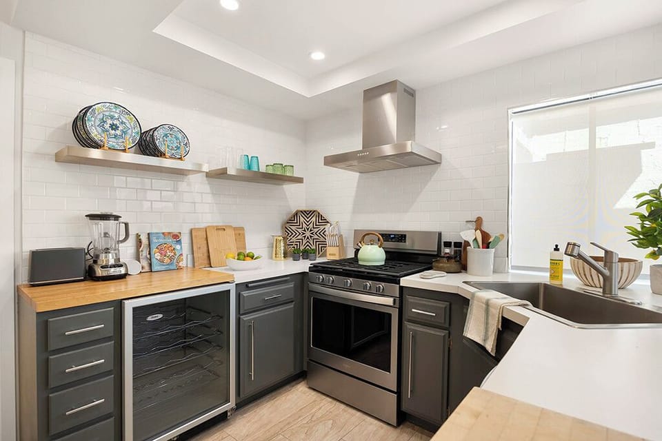 Refreshed kitchen with all new stainless steel appliances and wine frig.