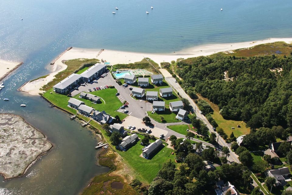 Picture your stay from above with beach and bay nearby.