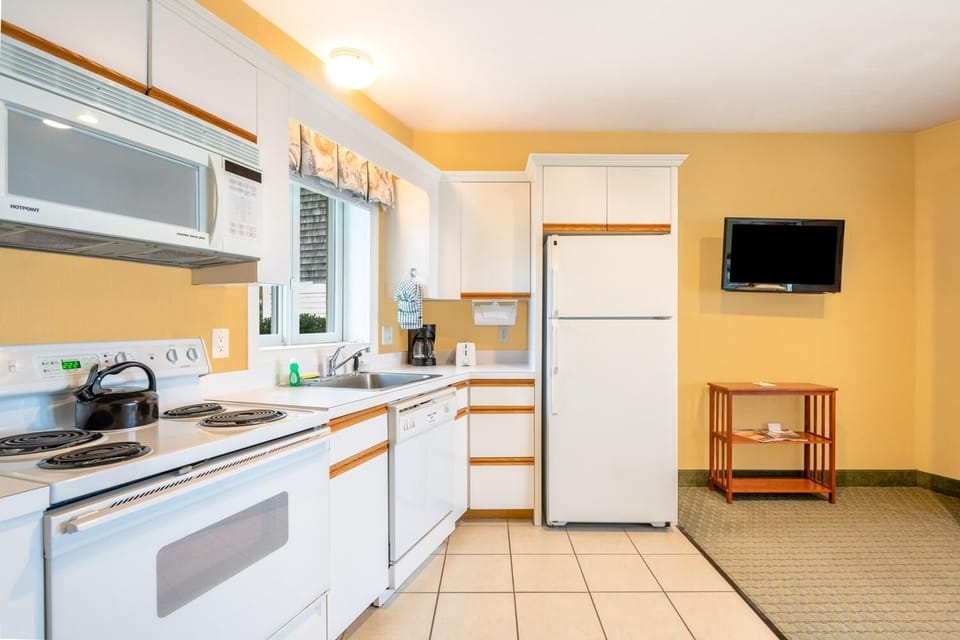 Cook easy meals in the bright kitchen with full appliances.