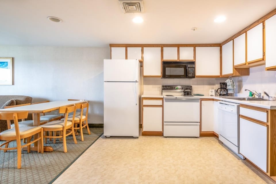 Gather for meals in the open kitchen and dining area.