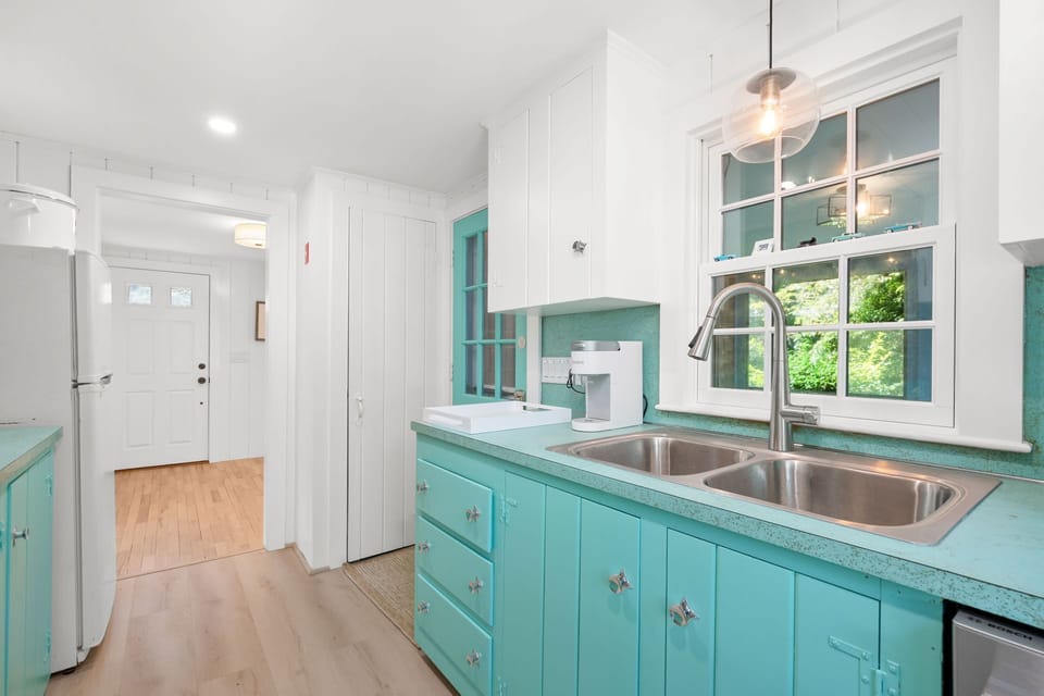 From the screened porch, you will arrive in the kitchen (formal/front entry door in the distance) - 78 Bucks Creek Road Chatham Cape Cod - Saltaire - NEVR