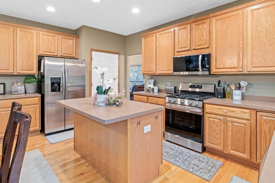The open kitchen is fully stocked with cookware, dinnerware, cooking essentials including coffee at Minne-Getaway: Timber Ridge.