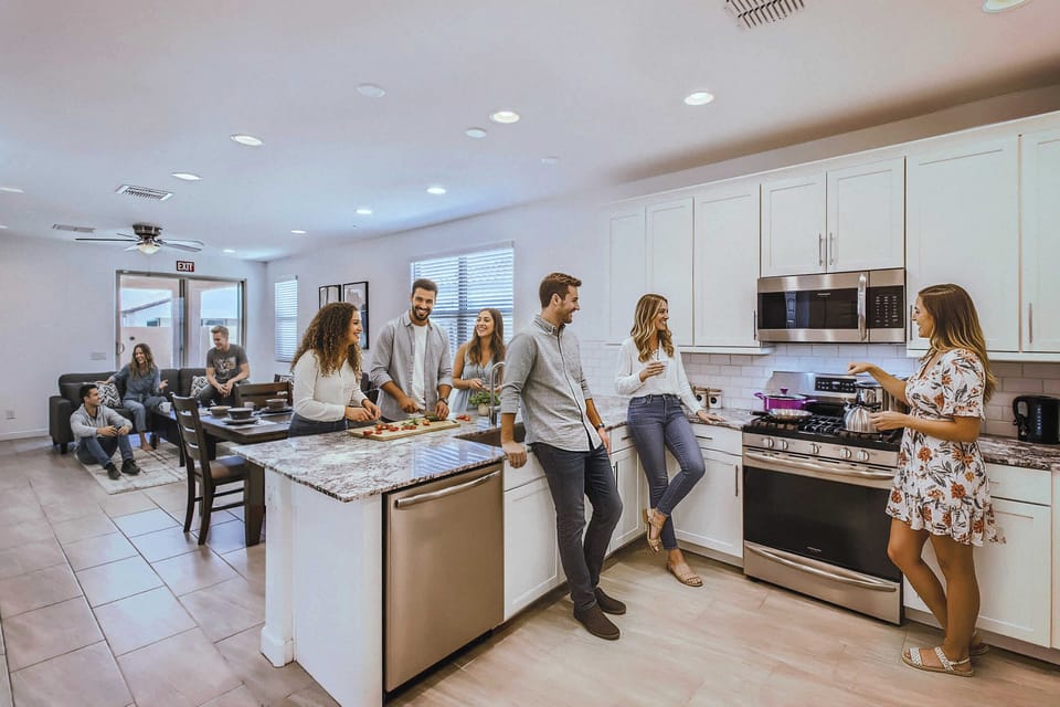 Enjoy the full kitchen and dining area with a refrigerator, freezer, oven, stove, microwave, dishwasher, coffee, creamers, mixers, spices, pots, pans, cooking supplies, cutlery, cups, plates, bowls, utensils, small appliances, and many more essential