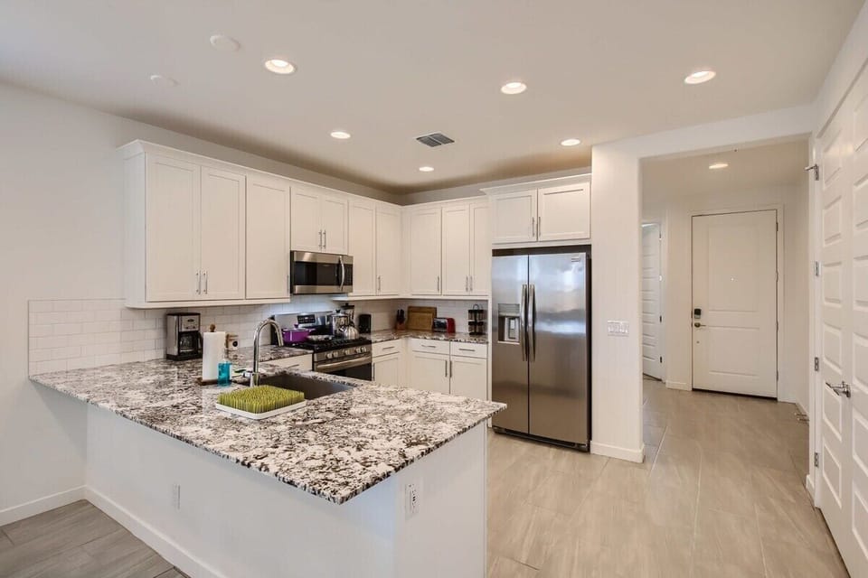 Enjoy the full kitchen and dining area with a refrigerator, freezer, oven, stove, microwave, dishwasher, coffee, creamers, mixers, spices, pots, pans, cooking supplies, cutlery, cups, plates, bowls, utensils, small appliances, and many more essentials.