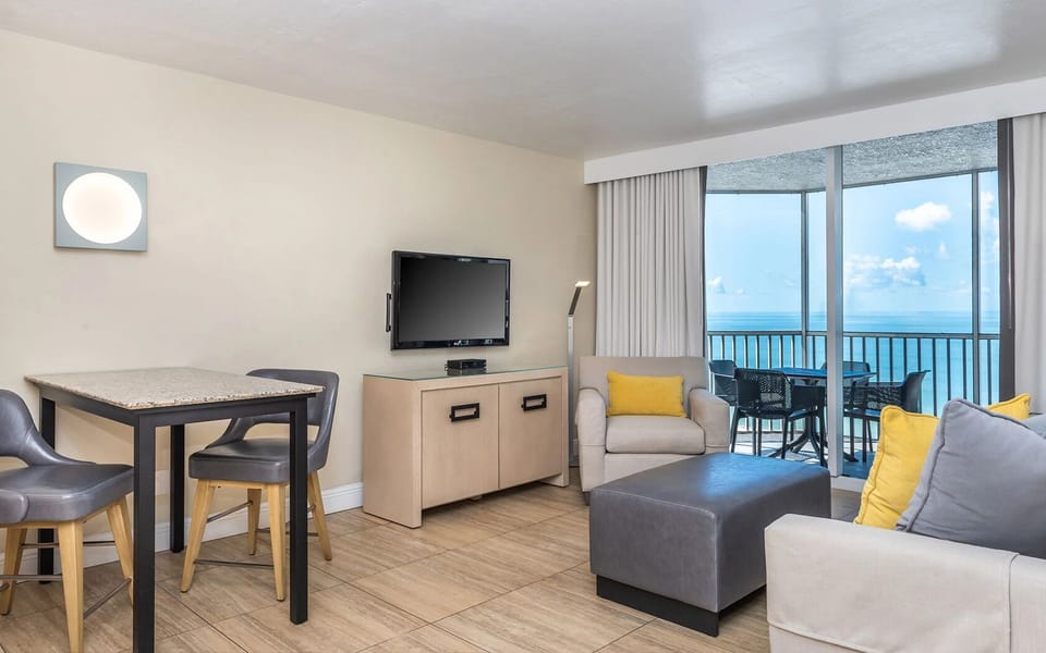 Gather by the sofa and savor breezy ocean views.