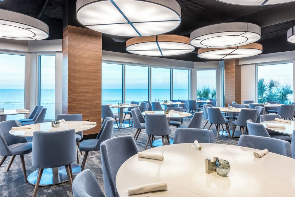 Settle into plush seating with uninterrupted sea views.
