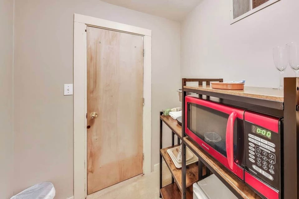 Entry area has coat rack, microwave and coffee station.