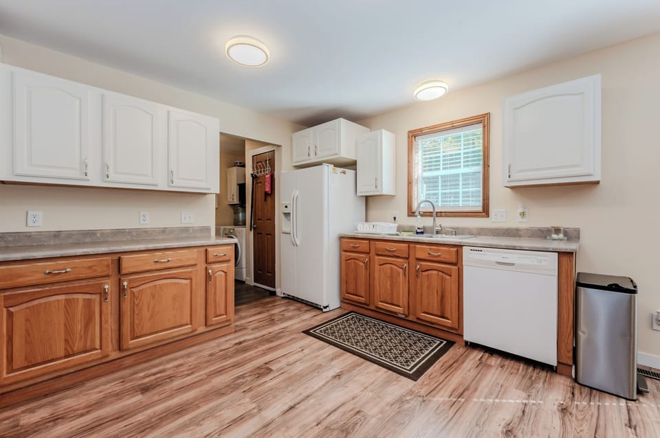 Prepare delicious meals in the fully stocked kitchen, complete with modern appliances, ample counter space, and a convenient dishwasher for easy clean-up.