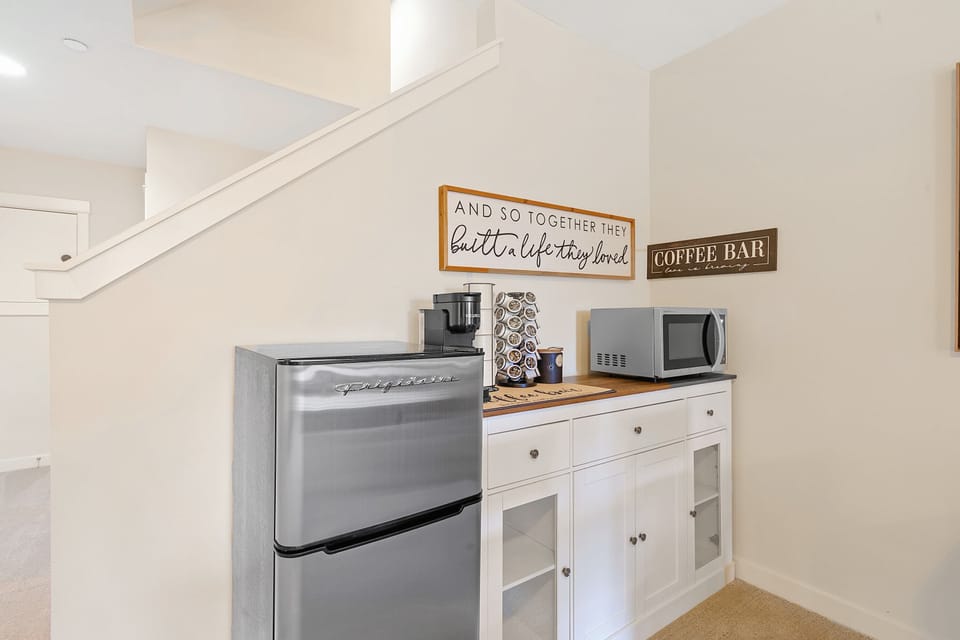 This well-equipped kitchenette features a mini-fridge, microwave, and coffee maker, perfect for preparing simple meals and snacks.