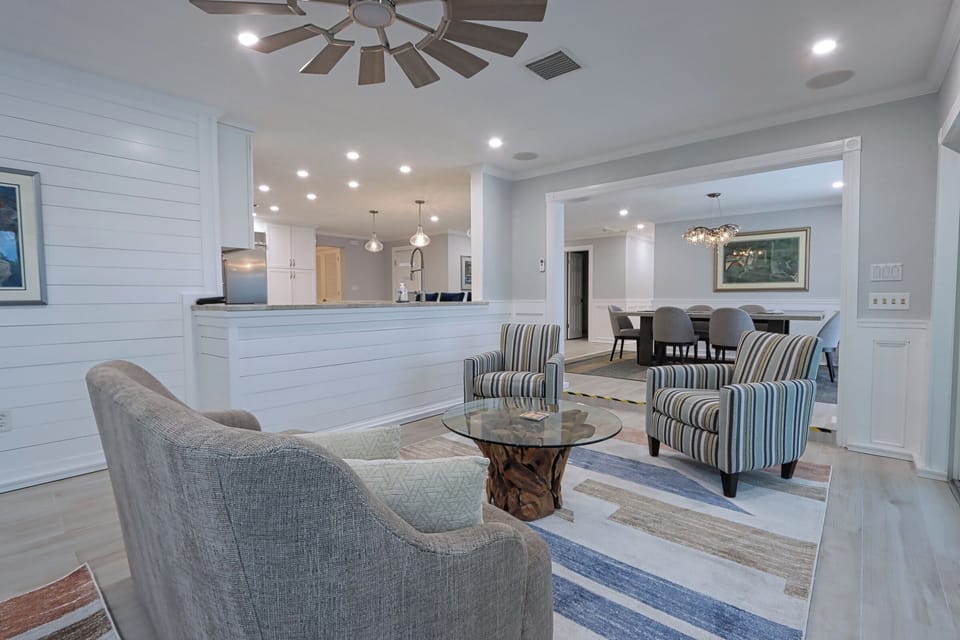 The open layout connects the kitchen, sitting area, and dining room, making it easy to cook, dine, and relax while staying part of the conversation.
