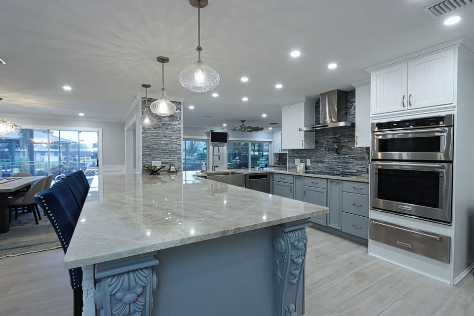 The stunning, open-concept kitchen is bright and spacious, featuring granite countertops, stainless steel appliances, and plenty of cabinet space.