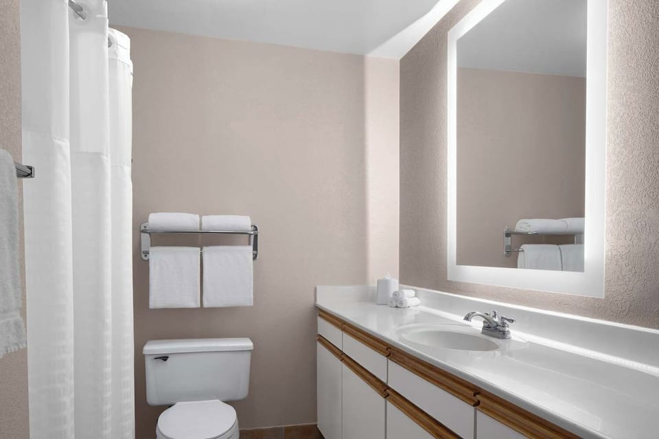 Refresh easily with a clean vanity and bright, modern mirror.