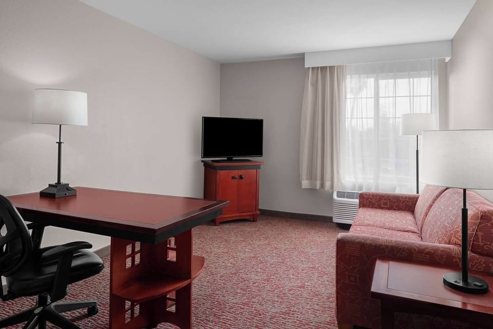 Spread out in the open living area with desk and seating.