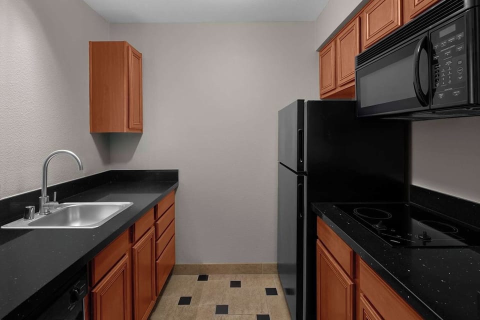 Cook easy meals in this clean, practical kitchenette.