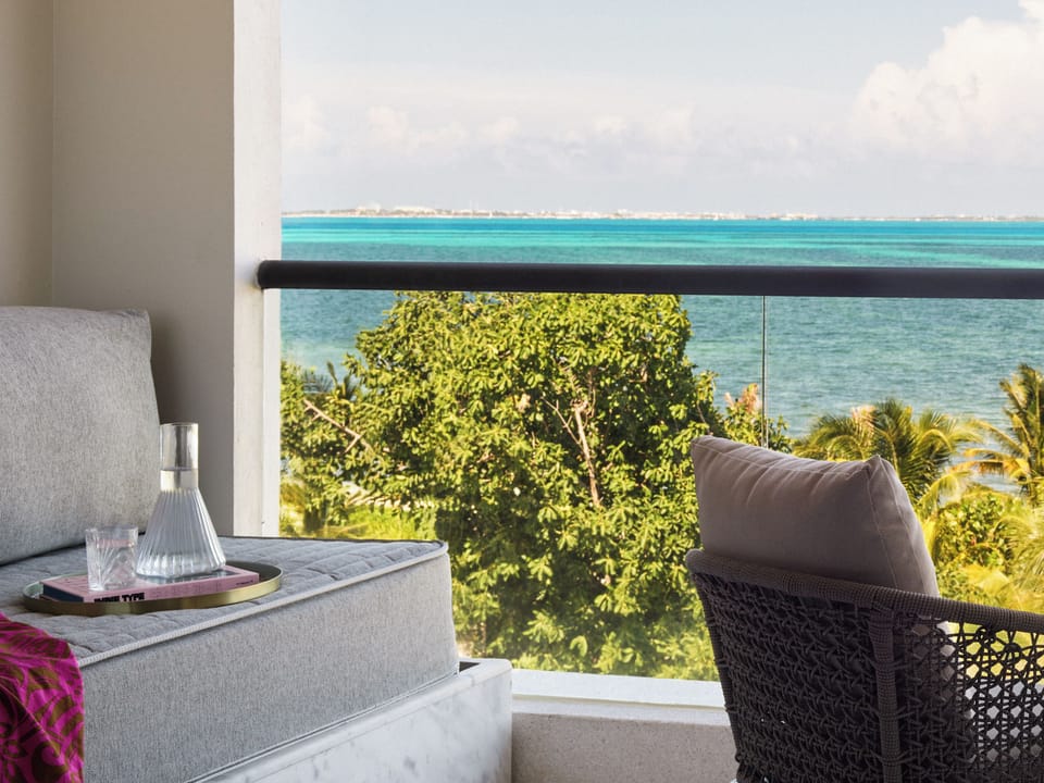 Breathe in endless turquoise horizons from your shaded balcony perch.