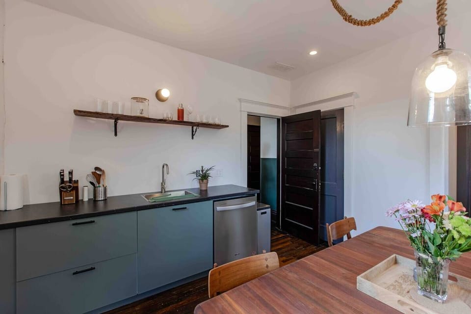 The streamlined kitchen comes equipped with everything you need.