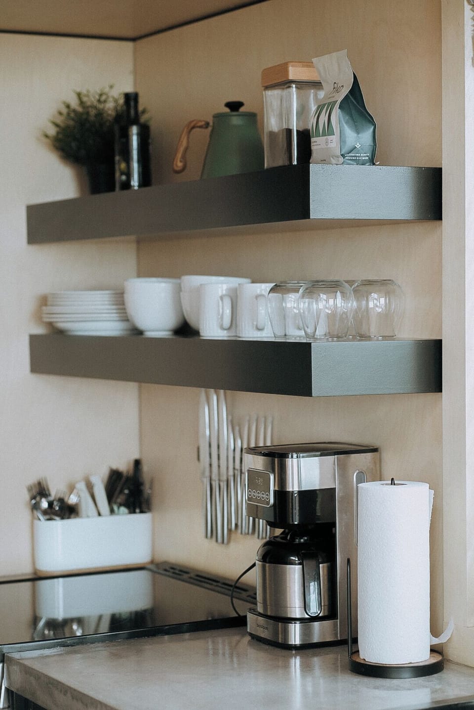 Full kitchen with electric range, fridge, microwave, and coffeepot. S+P, coffee, olive oil