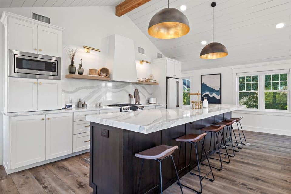 Fully stocked kitchen. Island seating for 5