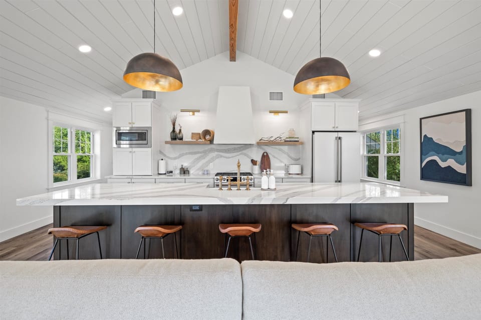 Gourmet kitchen with custom cabinetry and premium appliances.  Seating for 5.