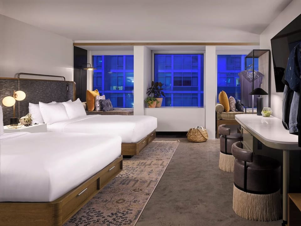 Settle in after sunset with spacious doubles and city glow.