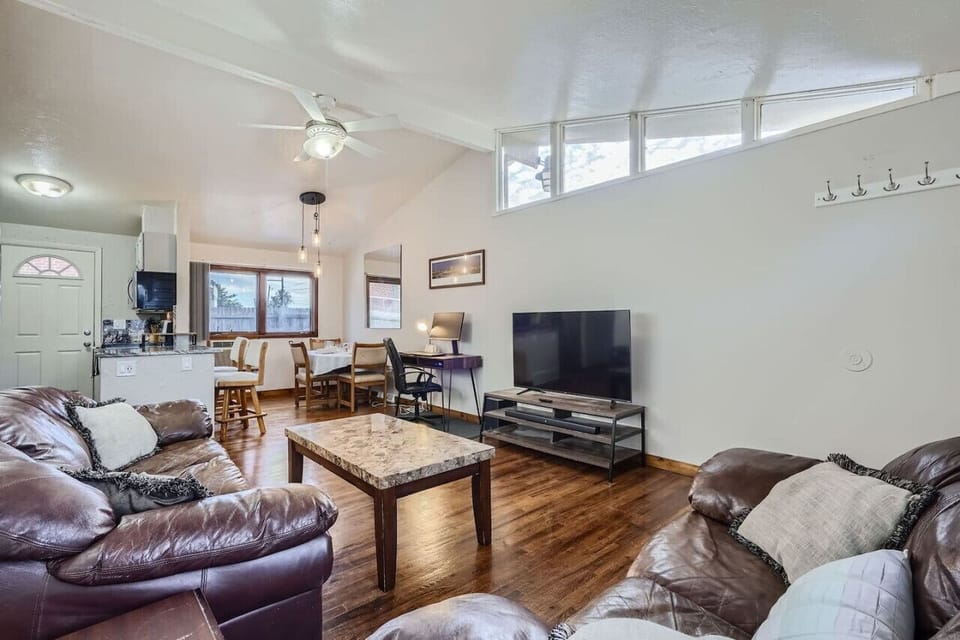 The open floor plan, vaulted ceilings, and natural light make the main area feel cozy and spacious