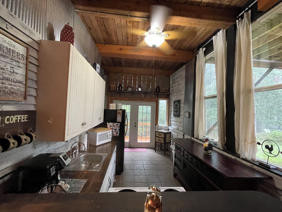 Full kitchen with electric range and refrigerator