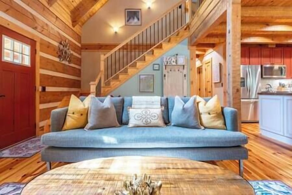 Inviting living room with rustic-modern design, vaulted ceilings & cozy seating