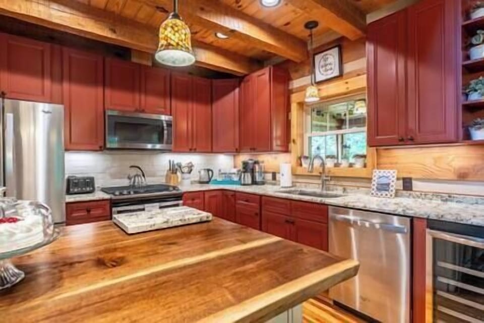 Fully equipped kitchen with granite, cherry wood accents & stainless appliances