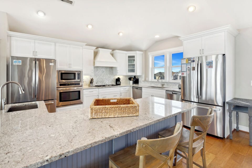 The fully equipped Kitchen has everything you need to prepare meals your family will love with two refrigerators, two dishwashers, two ovens, and a large breakfast bar with seating for six.