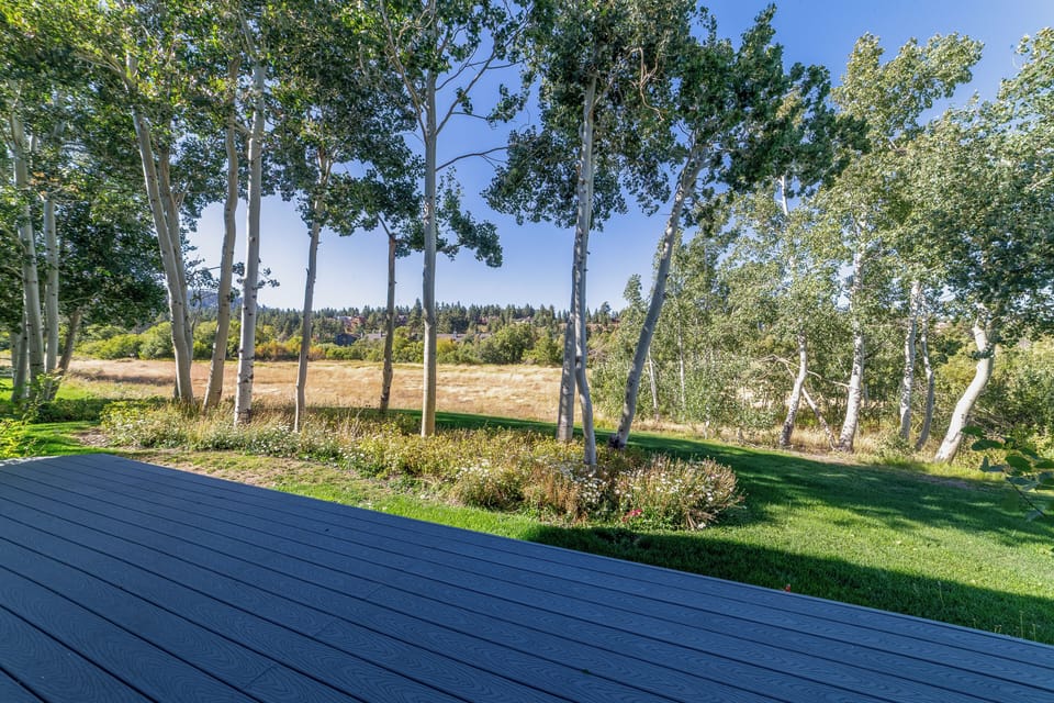 Private deck with unobstructed view of the Snowcreek meadow, surrounded with aspen trees.