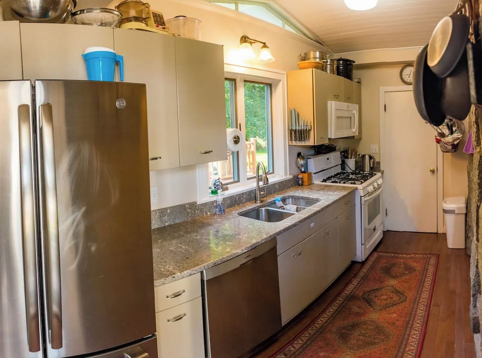 A well-equipped galley kitchen and extra bathroom were added to the exterior.