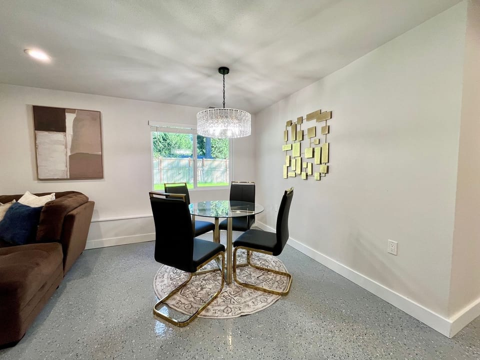 Features a small dining table that comfortably seats four