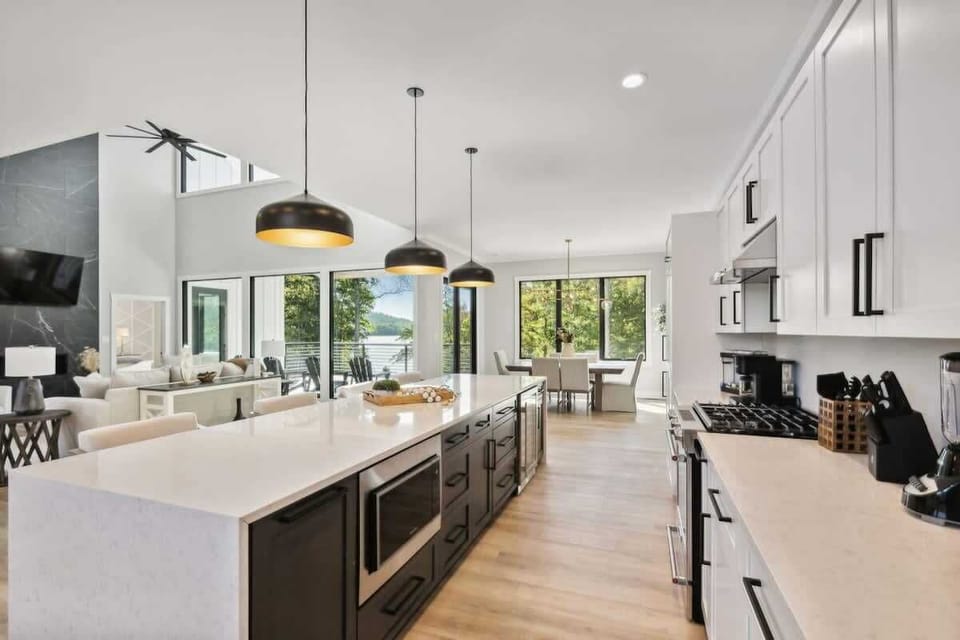 Fully stocked kitchen, quartz waterfall edge cabinets, bar stools and Kitchen Aid appliances!