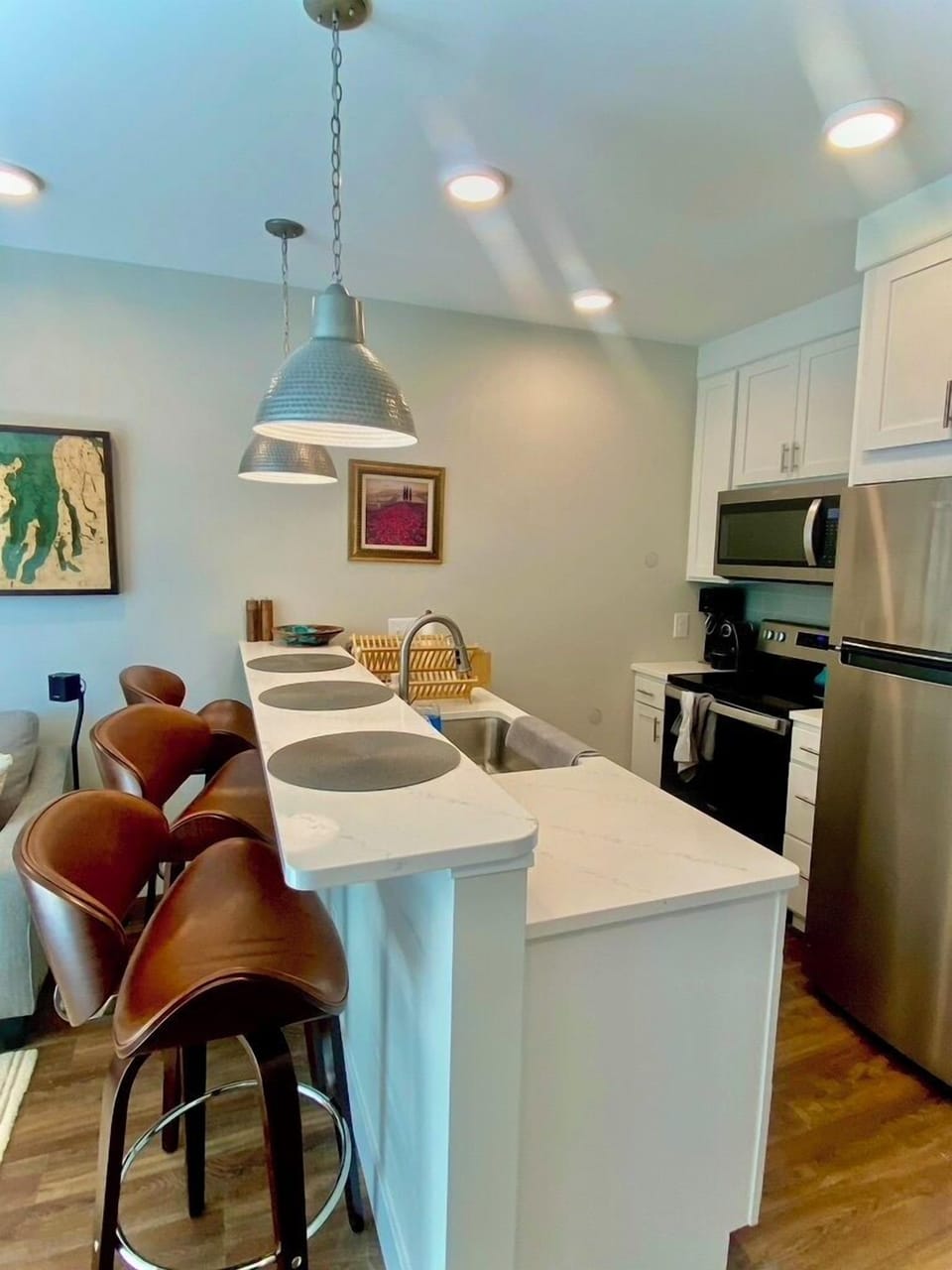 Our kitchen is designed for both cooking and socializing, with a spacious countertop and bar seating.