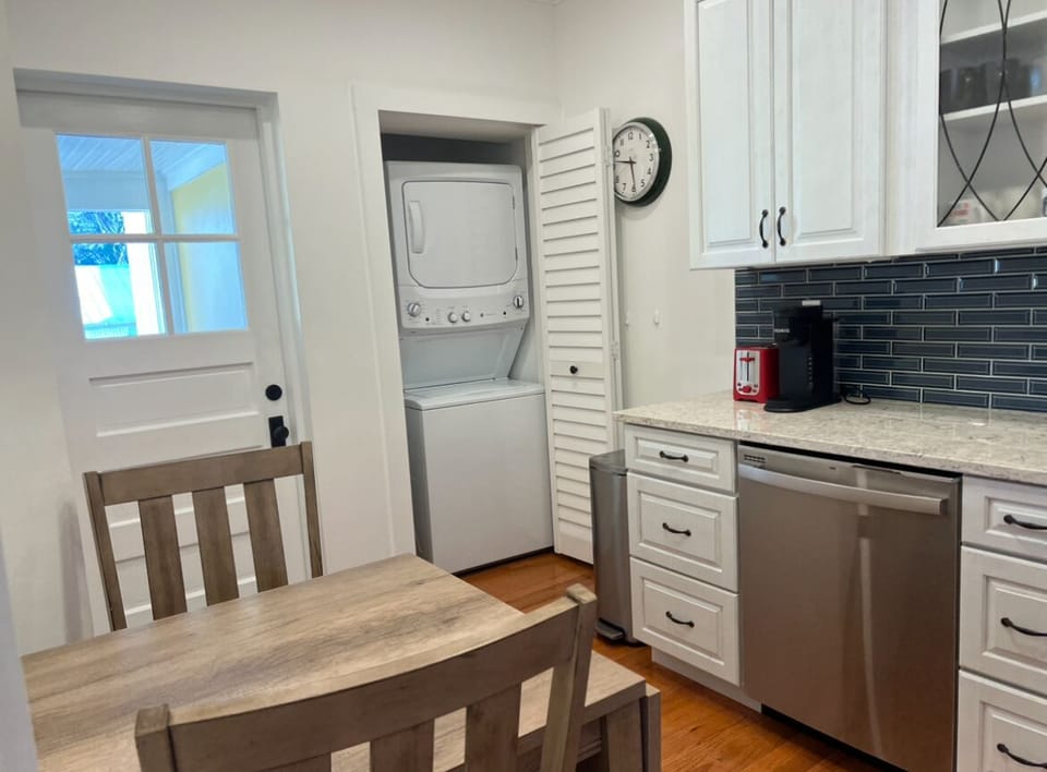 Washer and dryer located in kitchen.